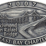 Custom all-metal lapel pin featuring detailed sculpted bridge and mountain artwork in a no‑enamel metal finish, crafted by The Pin Center
