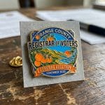 Soft enamel lapel pin featuring Orange County