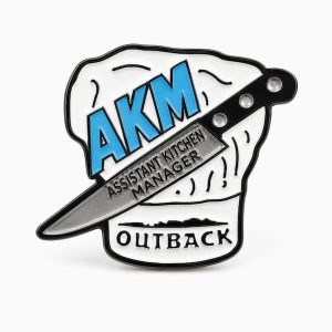 Outback "Assistant Kitchen Manager" lapel pin, created by The Pin Center, featuring a chef's hate and a butcher knife