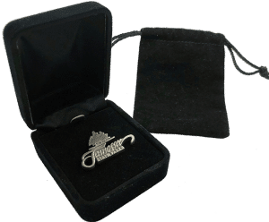 A black velvet pouch and a black velvet display box holding a custom enamel lapel pin, designed for professional recognition and presentation.