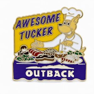 Outback‑themed ‘Awesome Tucker’ pin showing a chef‑kangaroo surrounded by a large, abundant feast in a playful food‑focused design.