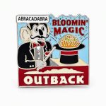 Outback‑themed ‘Bloomin Magic’ pin showing a magician koala conjuring a Bloomin’ Onion from his hat while saying ‘abra cadabra.’