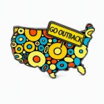 Outback‑themed pin displaying a polka‑dotted cartoon map of the lower 48 states with a bold ‘Go Outback’ sign emerging from the Midwest.
