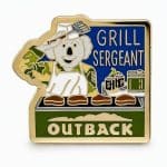 ‘Grill Sergeant’ pin featuring a koala in military fatigues manning a grill and saluting with a spatula while cooking steaks.