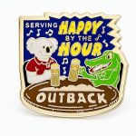 Kangaroo dressed up as Uncle Sam pointing at the viewer, saying 'We want you' with a USA flag in the backdrop. A lapel pin with the Outback logo, created by The Pin Center
