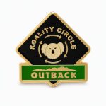 Lapel pin crafted by The Pin Center, with the phrase 'Koality Circle' with a happy koala and the Outback logo