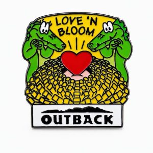 Two crocodiles lovingly looking at a hot steaming plate of Bloomin' Onion. Lapel pin with Outback logo, crafted by The Pin Center